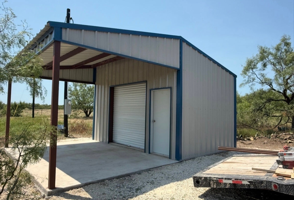 Metal shop building with a covered carport bay and white roll-up door on a cleared Texas site